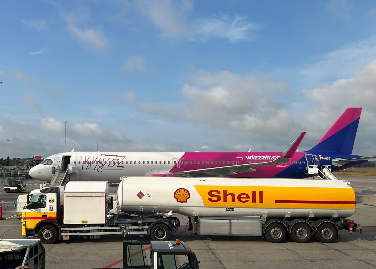 airplane-refueling-at-airport-with-fuel-truck-33300361